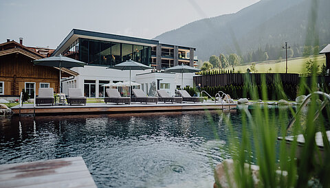 The mountain lake pool at the Lürzerhof wellness hotel in Salzburg