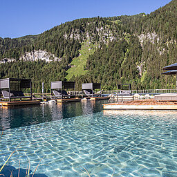 The mountain lake pool at the Lürzerhof wellness hotel in Salzburg