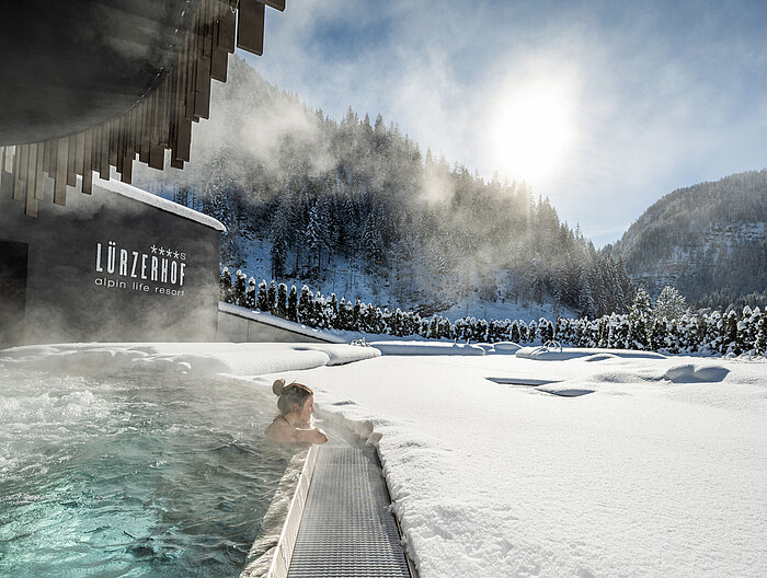 A woman enjoys some time in the adults-only pool at the Lürzerhof wellness hotel in Salzburg.
