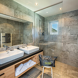 The bathroom in the Mountain Family Pure Family Suite at the Lürzerhof