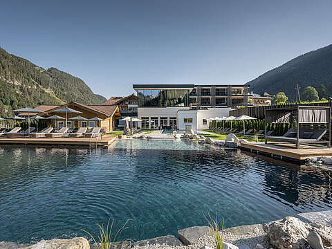 The mountain lake pool at the Lürzerhof wellness hotel in Salzburg