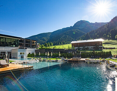 The mountain lake pool at the Lürzerhof wellness hotel in Salzburg
