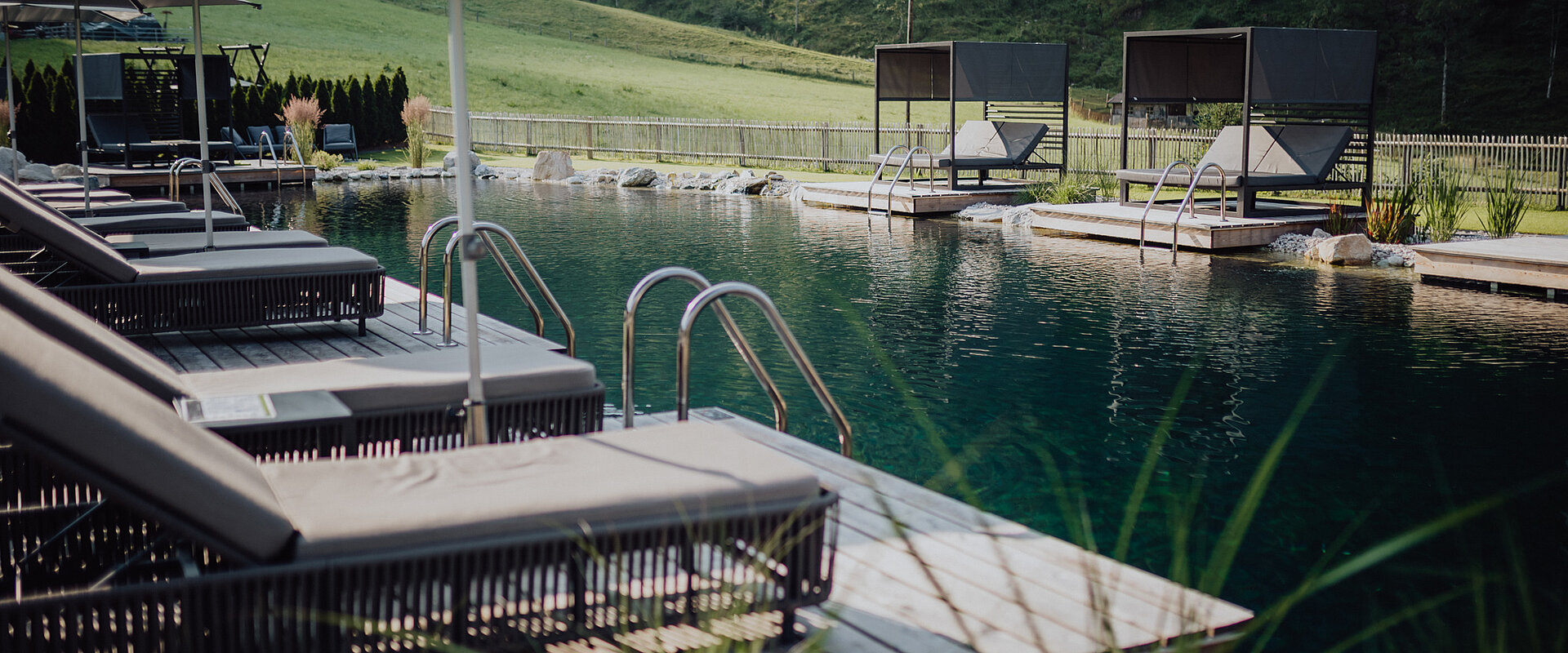 The mountain lake pool at the Lürzerhof Wellness Hotel in Salzburg