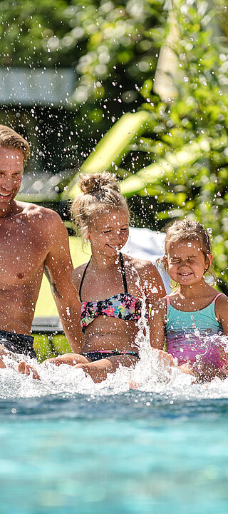 Family having fun at the pool at the LÃ¼rzerhof Wellness Hotel in Salzburg