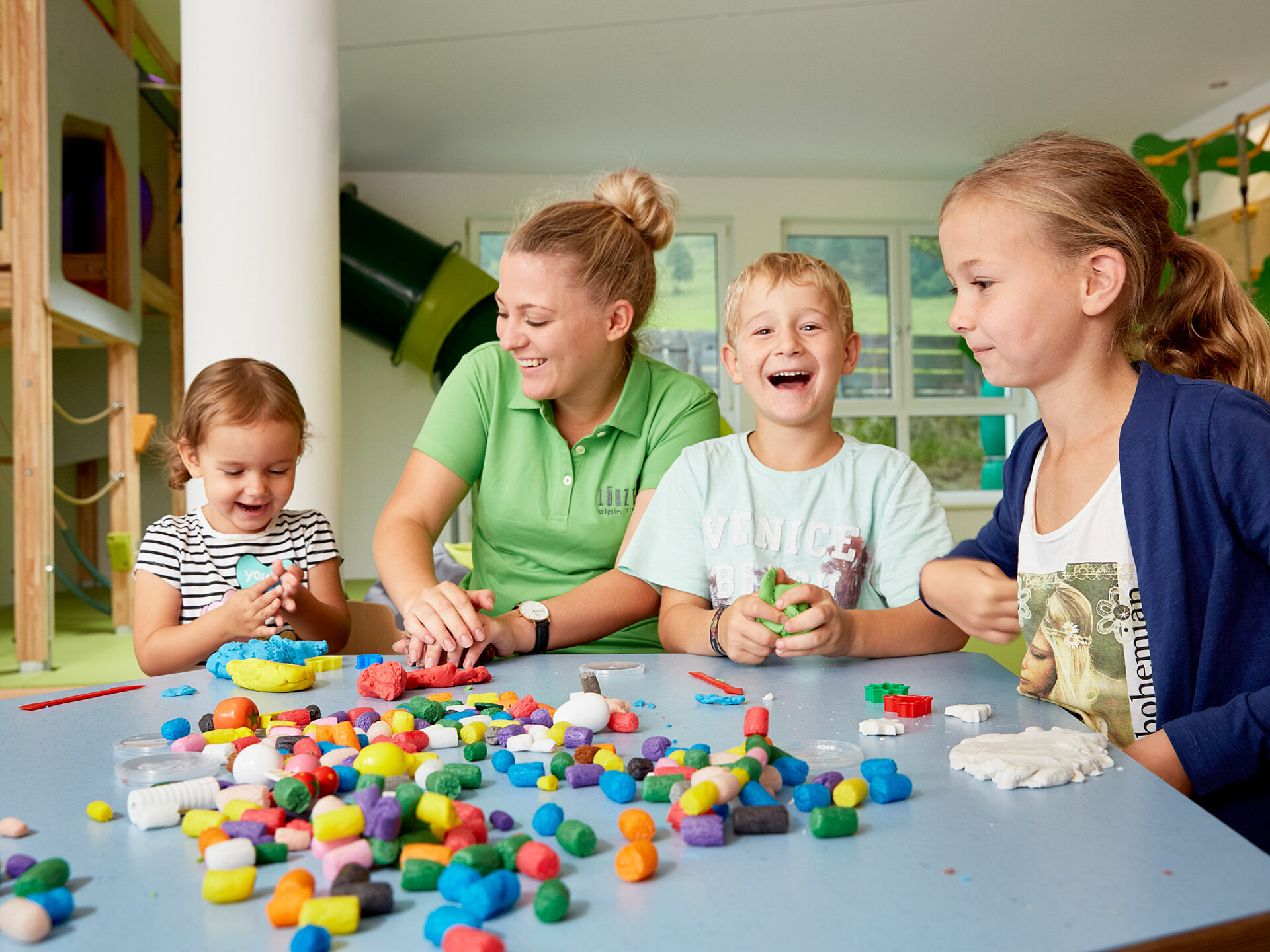 Children play in the play area of the Lürzerhof, the family hotel in Austria for vacations with children.
