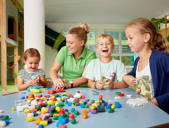 Children play in the play area of the Lürzerhof, the family hotel in Austria for vacations with children.