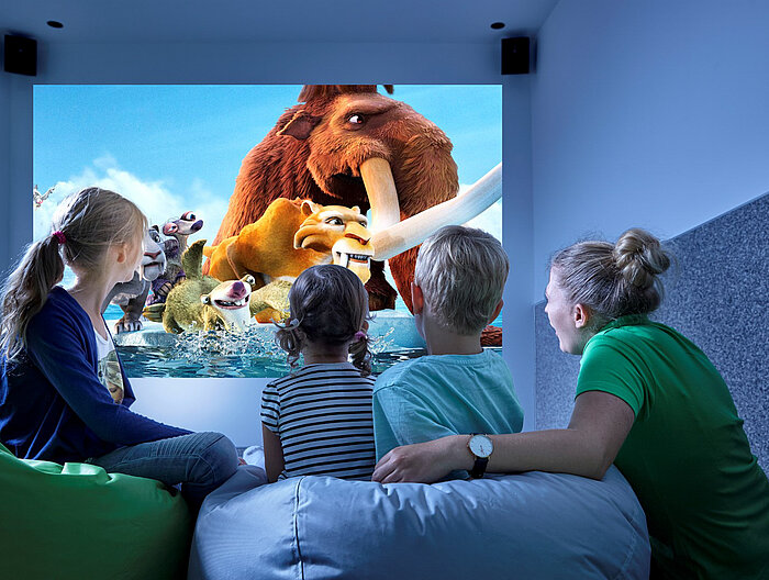 Children watch a movie in the play area of the Lürzerhof, the family hotel in Austria for vacations with children.