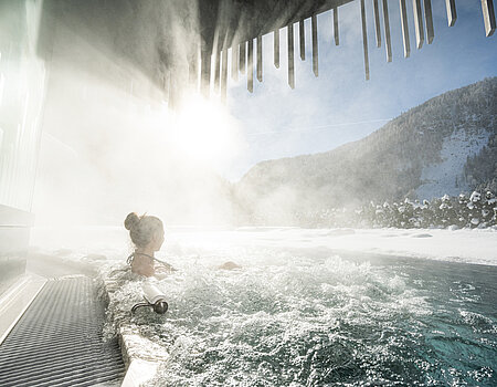 A woman enjoys some time in the adults-only pool at the Lürzerhof wellness hotel in Salzburg.