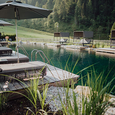 The mountain lake pool at the Lürzerhof wellness hotel in Salzburg
