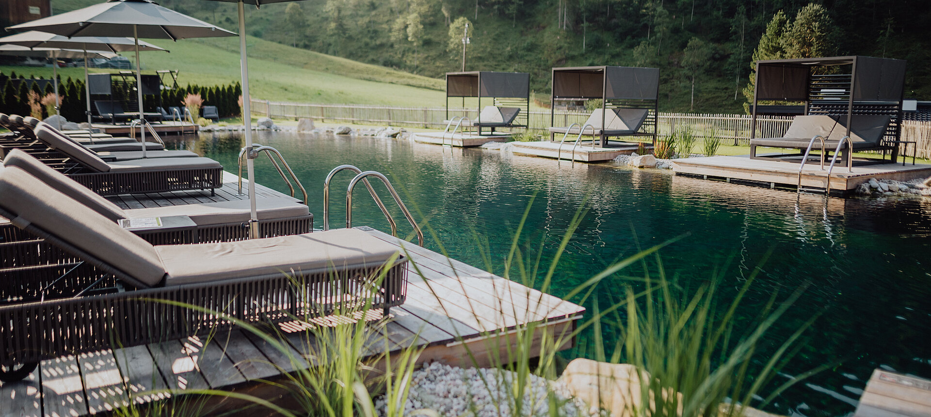 The mountain lake pool at the Lürzerhof wellness hotel in Salzburg